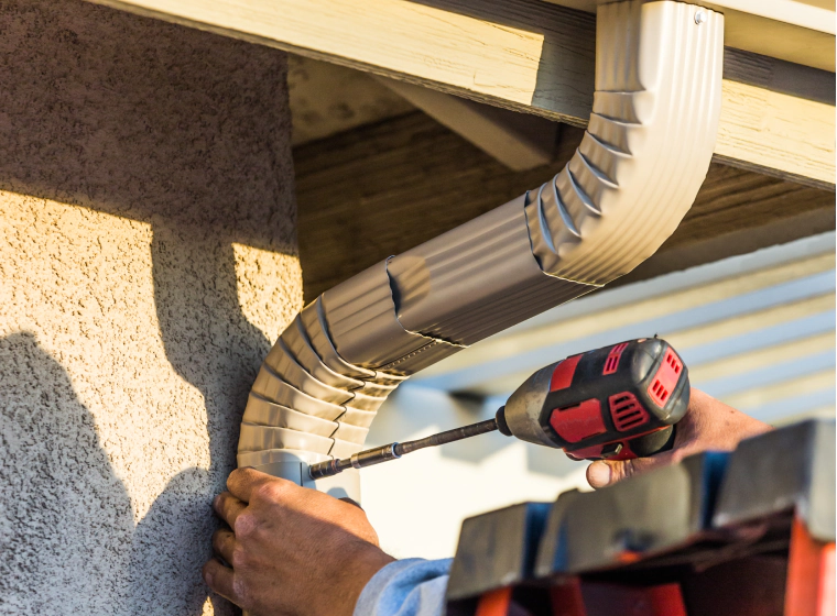 driller used in installing new gutter
